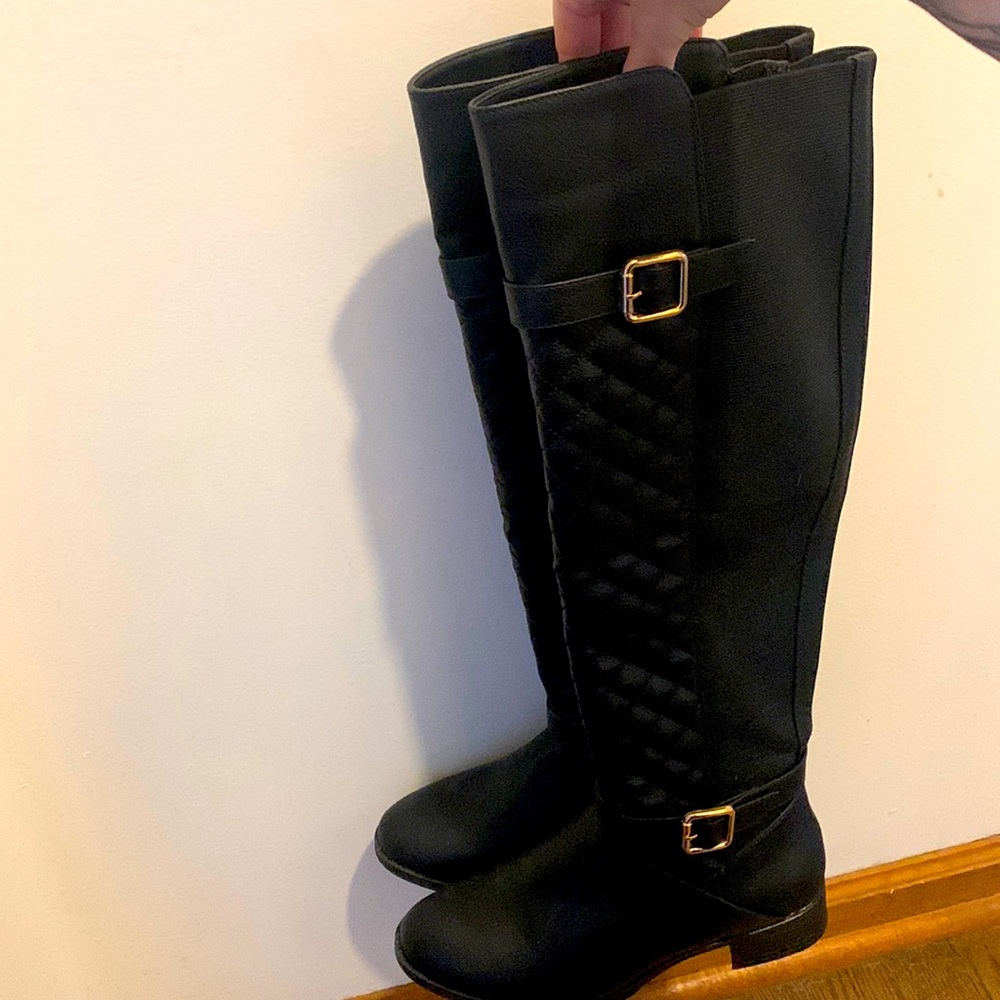 Black knee high boots.